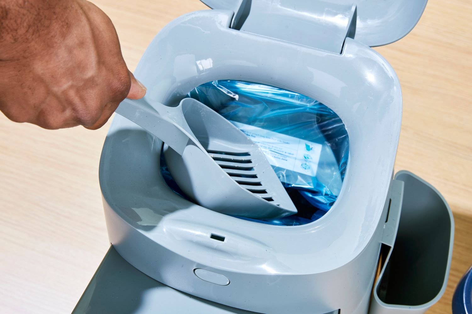 A close up of the open lid on the Litter Genie Easy Roll Cat Litter Disposal System