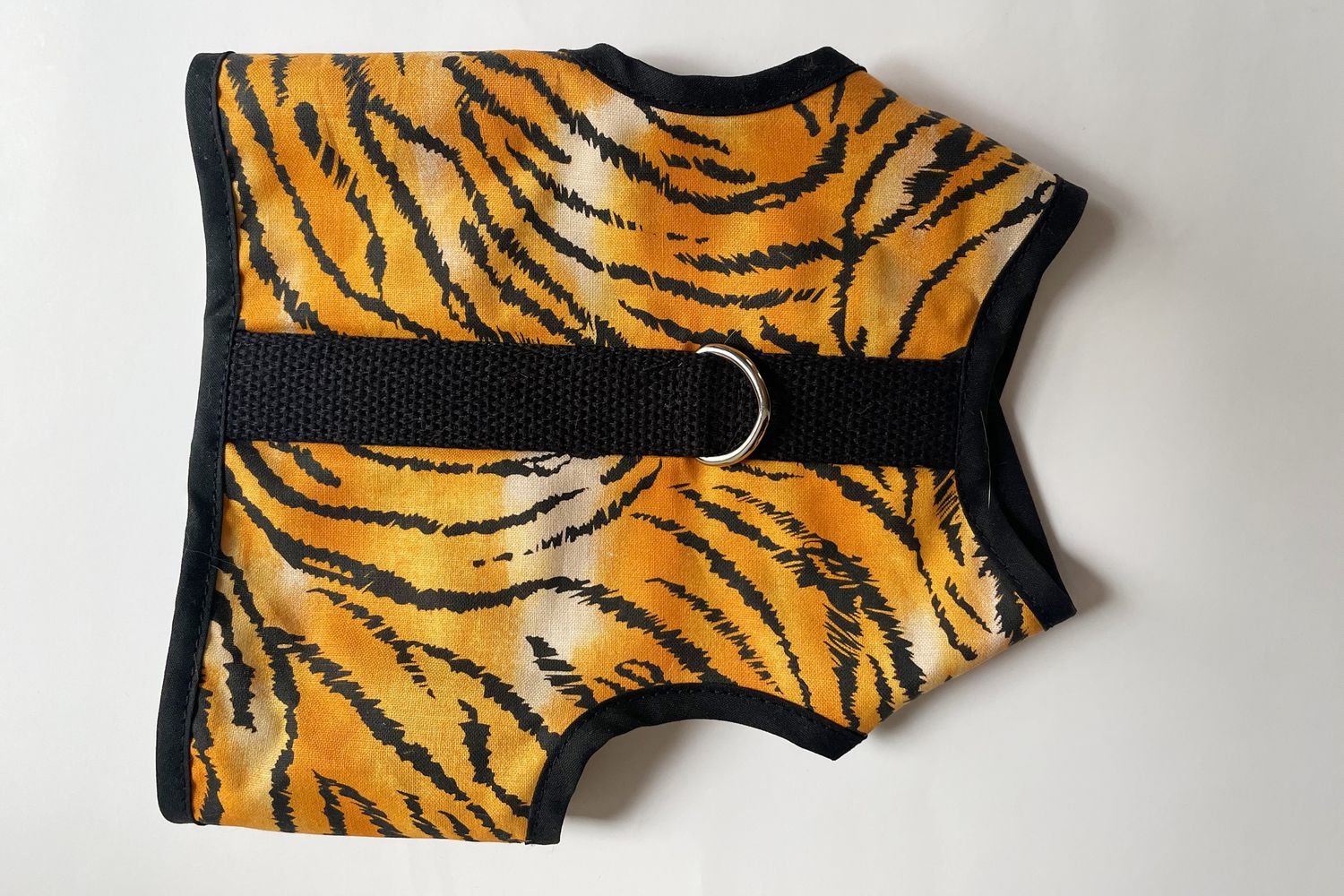 The Kitty Holster Cat Harness on a white background