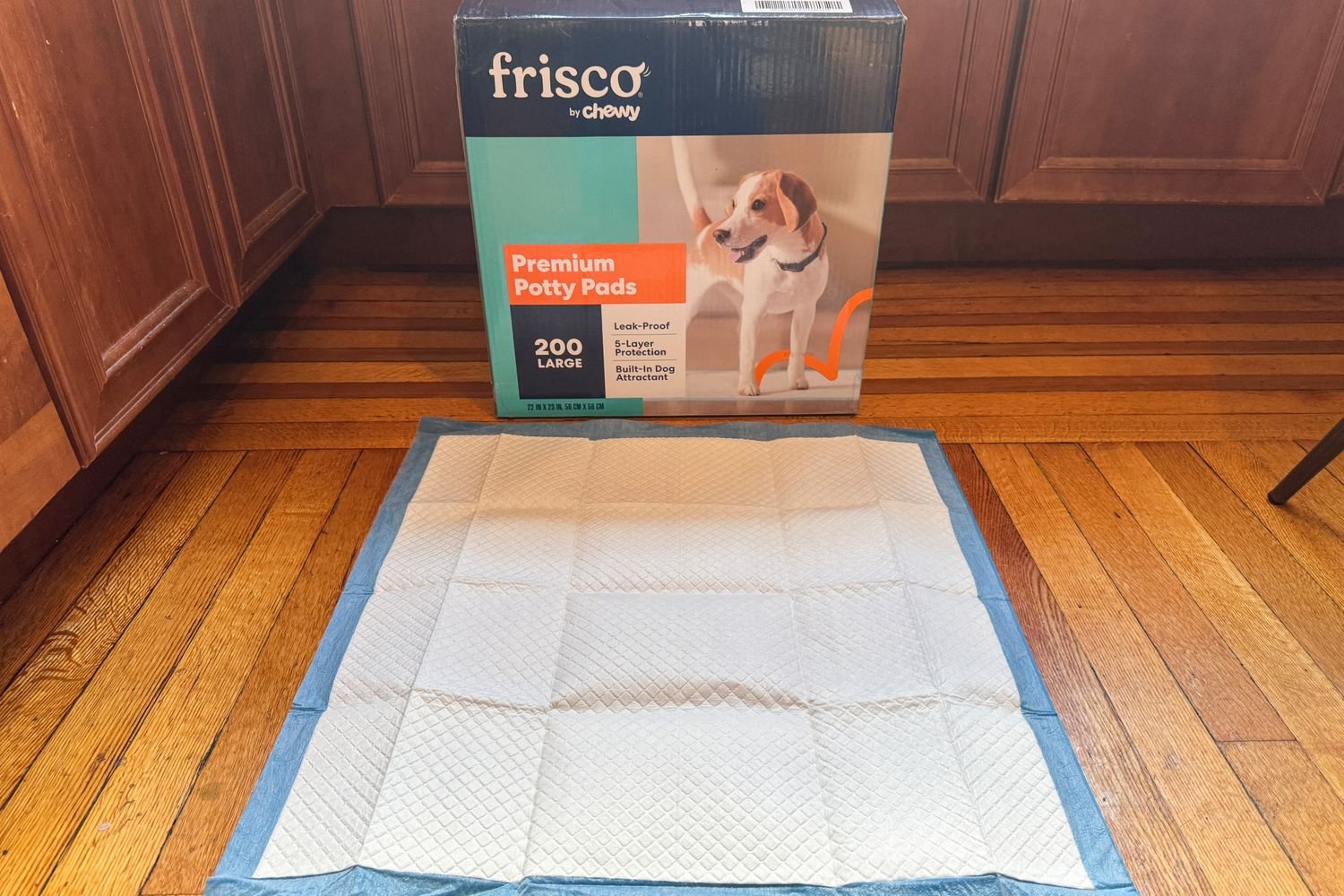 Frisco Premium Potty Pad in front of a box